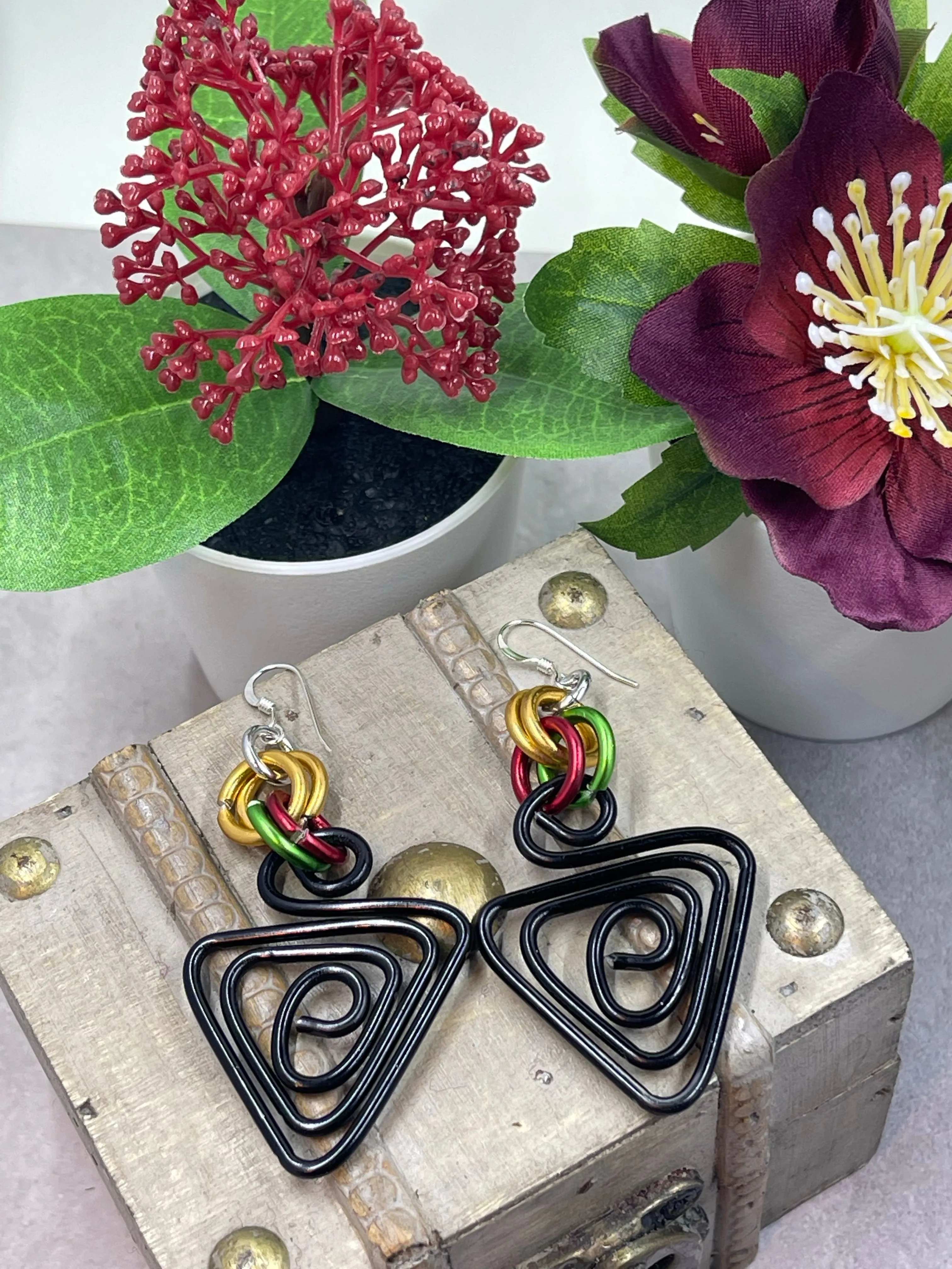 Black Triangle with green, red and gold