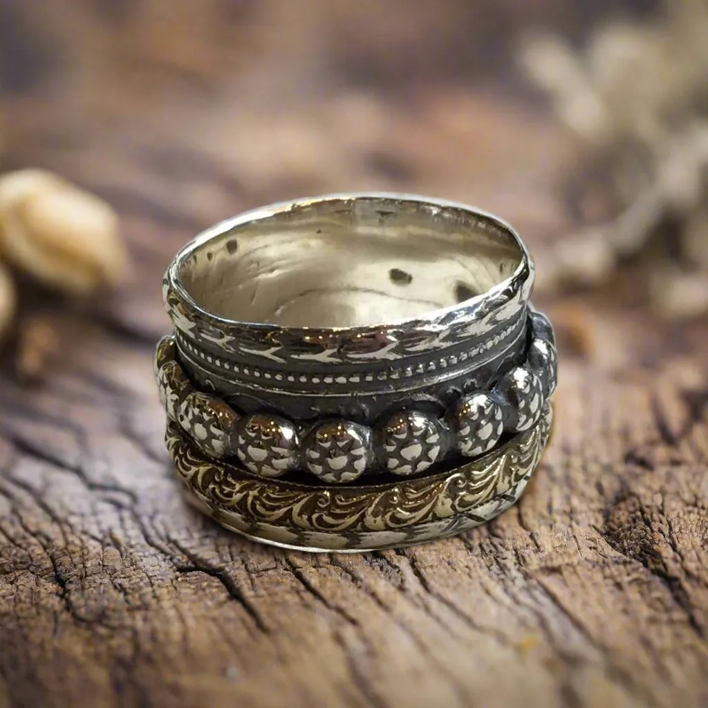 Silver Brass Spinners Ring - Reunion.