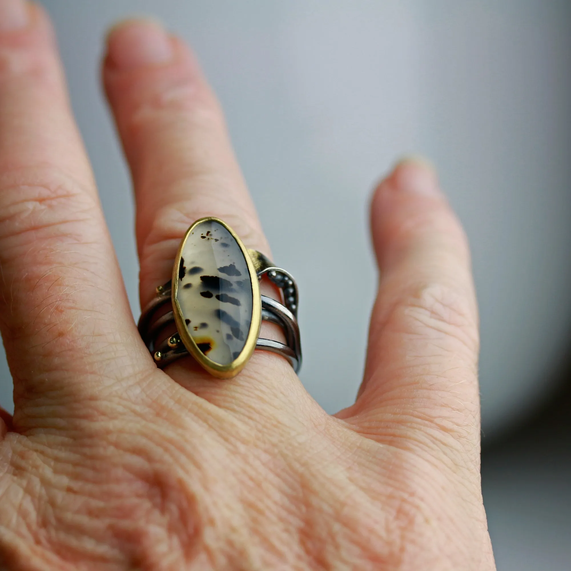 Sold! Montana Moss Agate on a Swirled Band. Size 7 1/4.