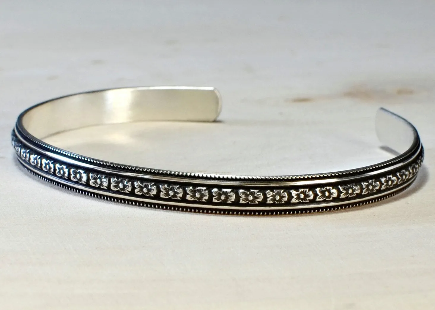 Sterling Silver Hibiscus Flower Patterned Bracelet with dark Patina